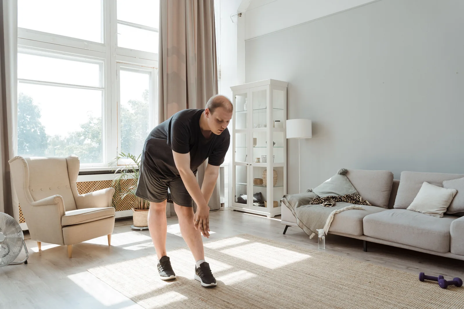 Active older man beginning a gentle morning movement routine